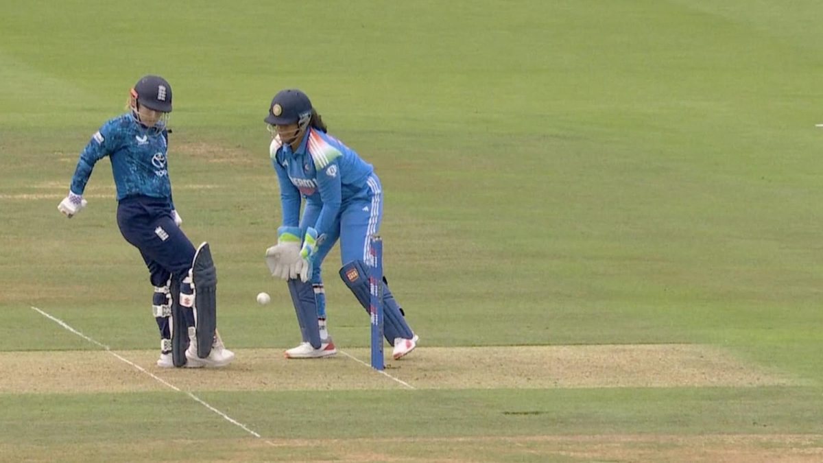 Tammy Beaumont moves her right leg towards the ball as India wicketkeeper Richa Ghosh attempts to collect it