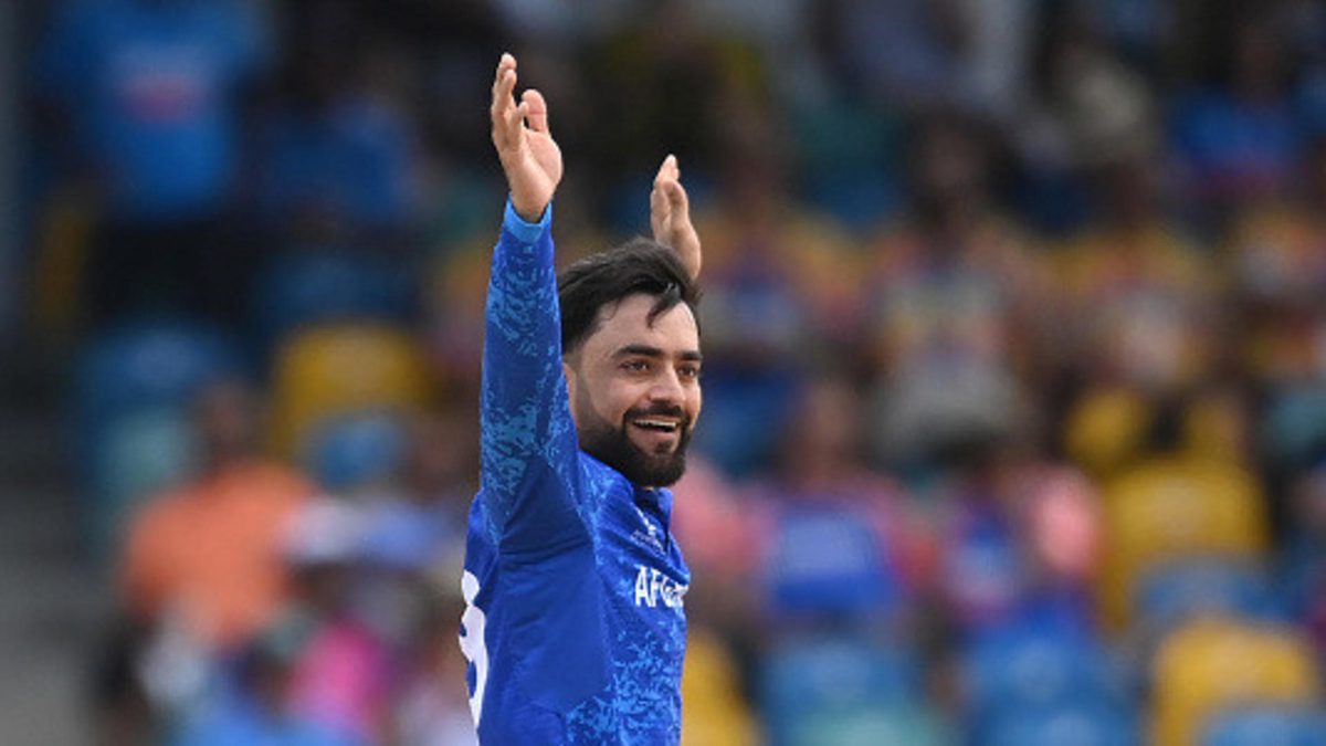 Rashid Khan of Afghanistan celebrates after dismissing Virat Kohli during the ICC Men's T20 Cricket World Cup West Indies & USA 2024 Super Eight match between Afghanistan and India at Kensington Oval on June 20, 2024 in Bridgetown, Barbados
