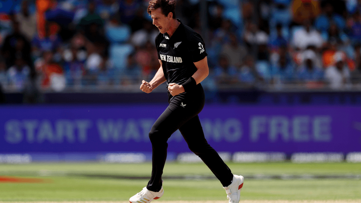 Matt Henry celebrates taking a wicket in the Champions Trophy