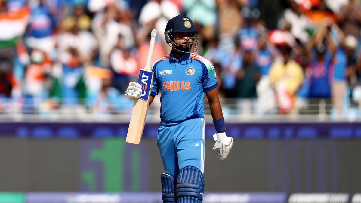 Shreyas Iyer of India raises his bat as he acknowledges the fans after reaching his half century after scoring 50 runs during the ICC Champions Trophy 2025 match between New Zealand and India at Dubai International Cricket Stadium on March 02, 2025 in Dubai, United Arab Emirates