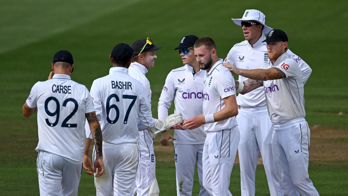Gus Atkinson of England celebrates with his team after dismissing Tom Latham of New Zealand during day two of the Third Test Match in the series between New Zealand and England at Seddon Park on December 15, 2024 in Hamilton, New Zealand