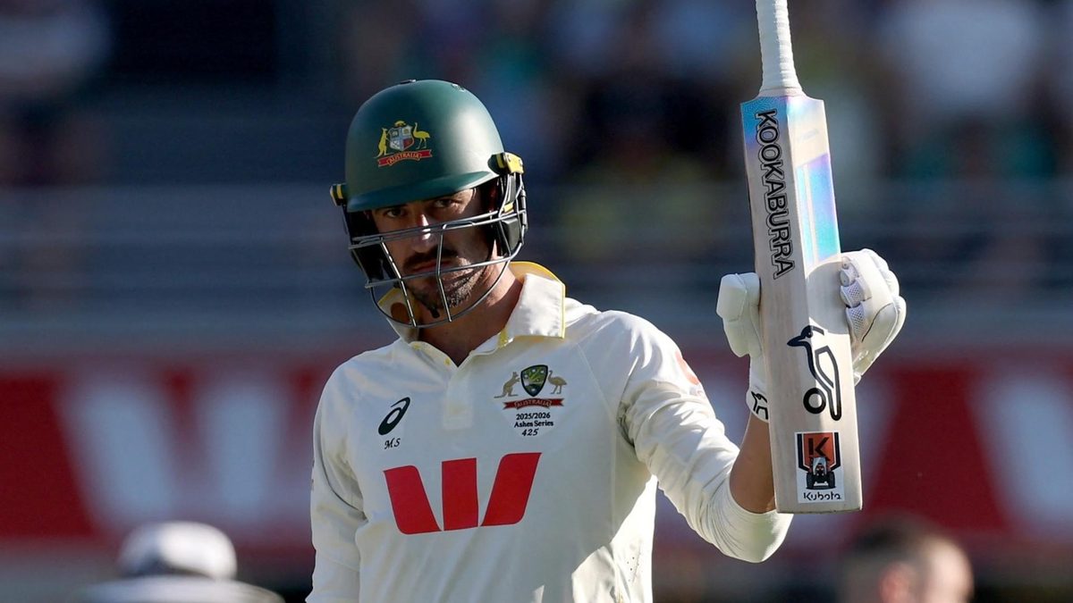 Mitchell Starc celebrates reaching a Test half-century at Brisbane