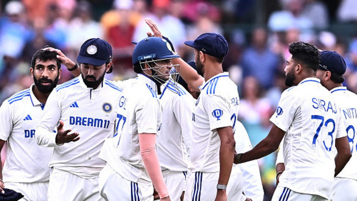 Team India celebrates with Usman Khawaja of Australia during day one of the Fifth Men's Test Match in the Border-Gavaskar Trophy series between Australia and India at Sydney Cricket Ground (SCG). Final score; India - 185/10 in 72.2 overs, Australia 9/1 in 3 overs