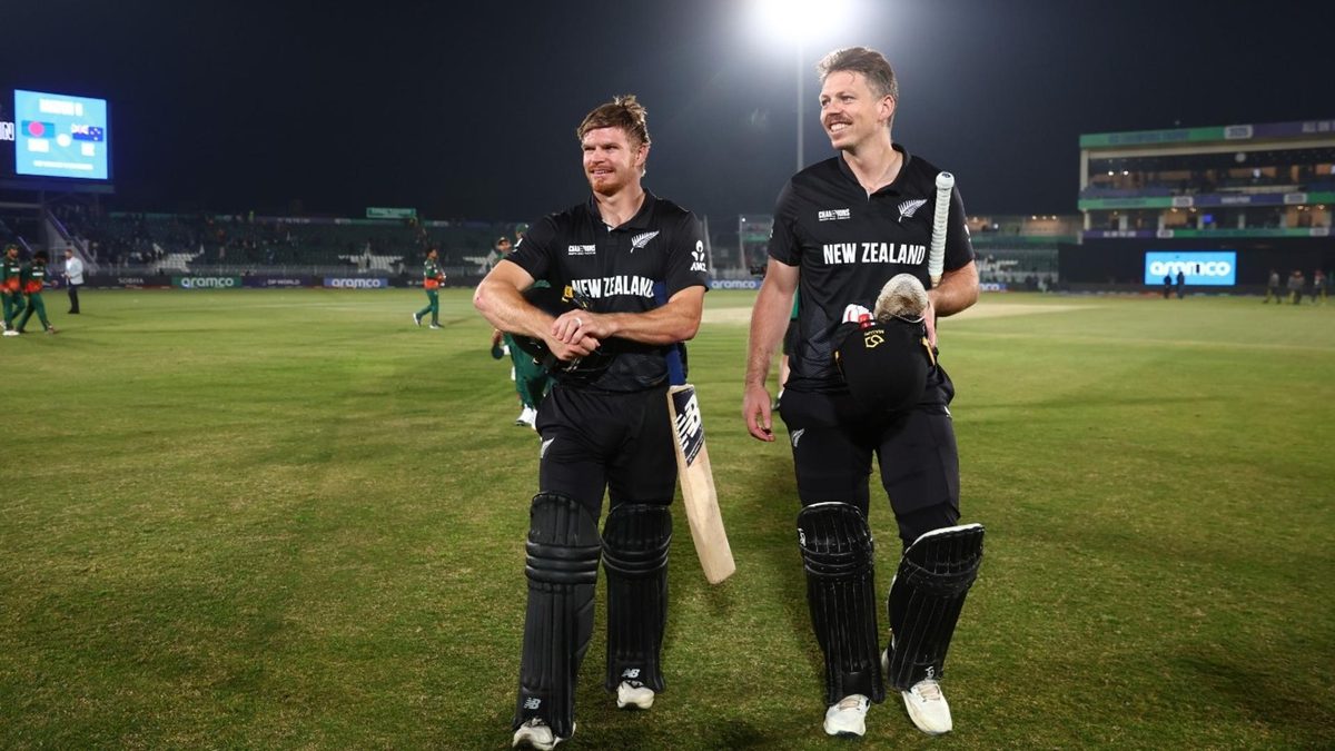 Glenn Phillips and Michael Bracewell walk off the field after sealing a win for New Zealand over Bangladesh in the 2025 Champions Trophy