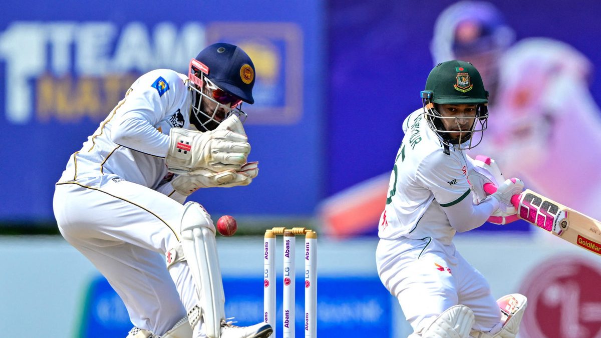 Bangladesh's Mushfiqur Rahim (R) watches the ball after playing a shot during the fifth and last day of the first Test cricket match between Sri Lanka and Bangladesh at the Galle International Cricket Stadium in Galle on June 21, 2025
