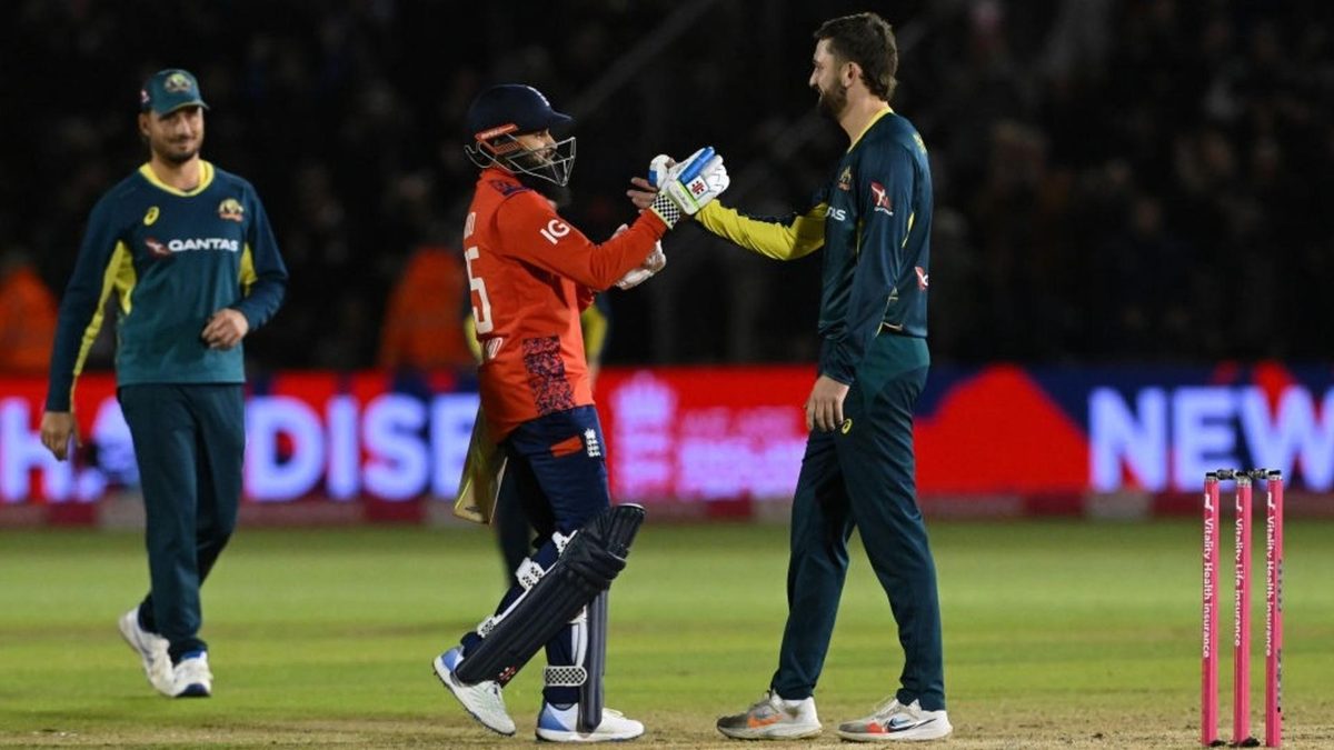 England and Australia players shake hands in the second T20I. The third T20I in Manchester could be affected by rain.