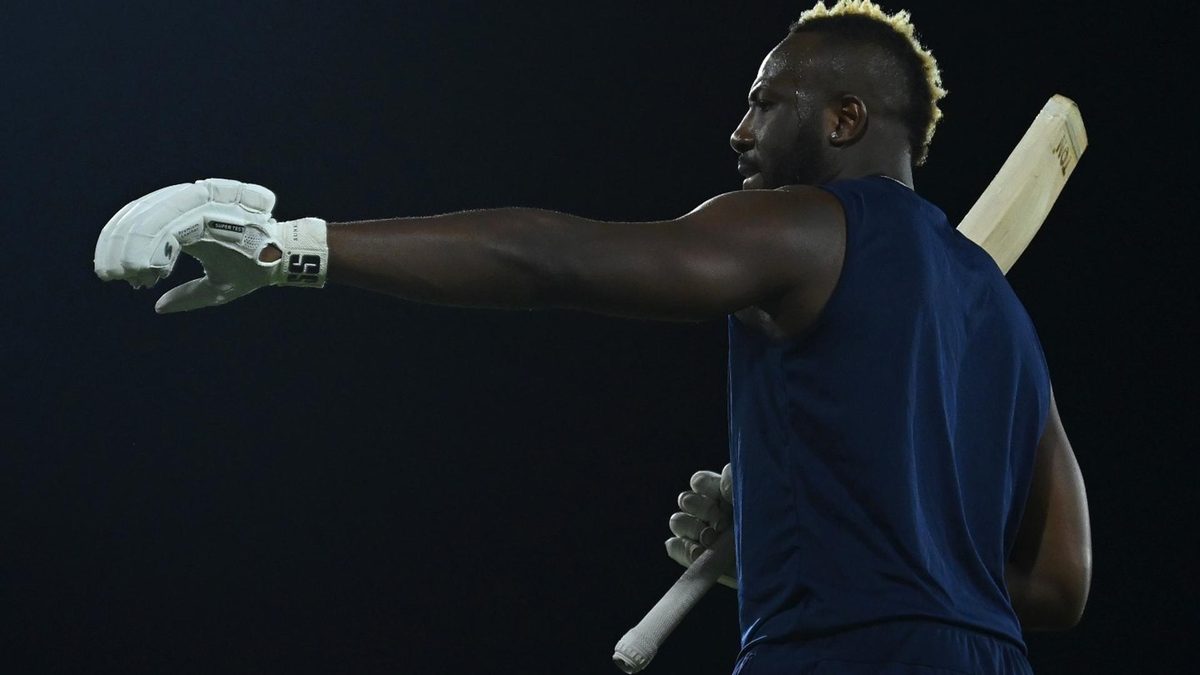 Andre Russell stretches his arm during a West Indies training session