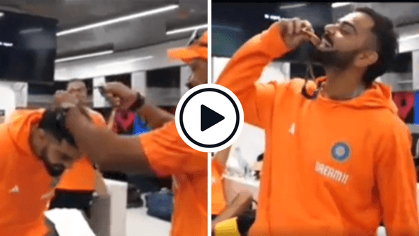 watch-virat-kohli-soaks-in-applause-bites-dressing-room-medal-olympic-style-after-australia-win.Click to read full article.