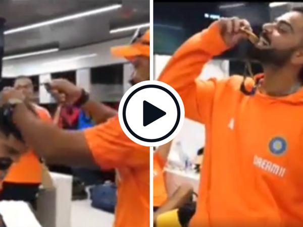 watch-virat-kohli-soaks-in-applause-bites-dressing-room-medal-olympic-style-after-australia-win.Click to read full article.