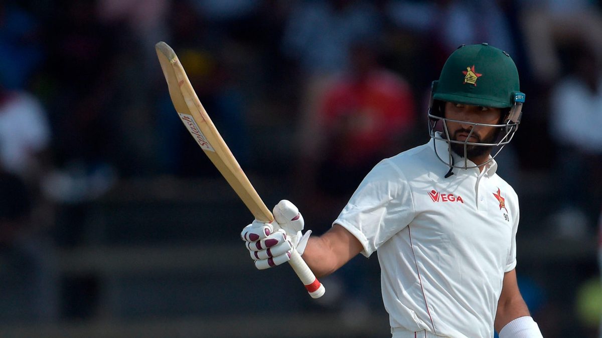 Zimbabwe's Sikandar Raza celebrates after scoring a half-century (50 runs) during the first day of the second Test cricket match between Zimbabwe and Sri Lanka at the Harare Sports Club in Harare on January 27, 2020