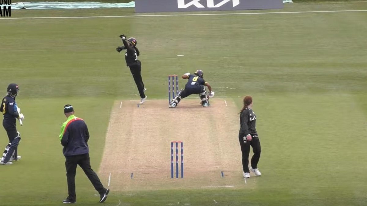 Davina Perrin ducks a throw from Surrey's Dani Gregory