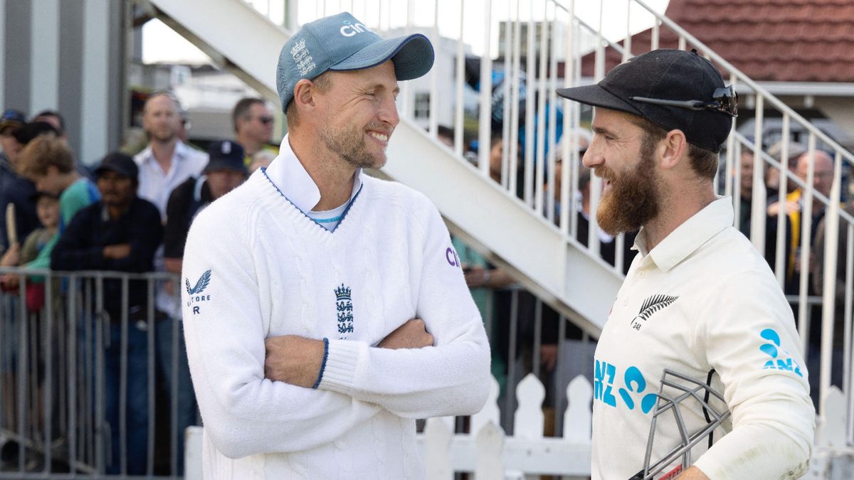 New Zealand's Kane Williamson (R) speaks with England's Joe Root after the second cricket Test match between New Zealand and England at the Basin Reserve in Wellington on February 28, 2023