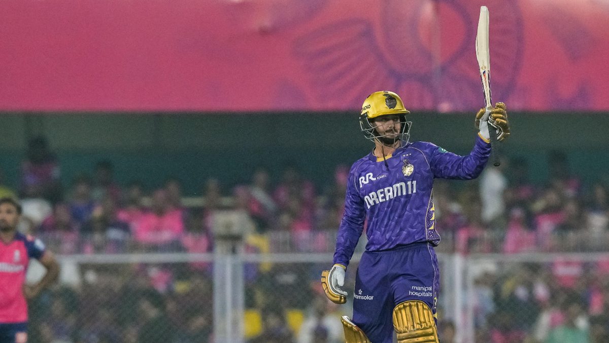 Kolkata Knight Riders' Quinton de Kock (R) celebrates after scoring a half-century (50 runs) during the Indian Premier League (IPL) Twenty20 cricket match between Rajasthan Royals and Kolkata Knight Riders at the Barsapara Cricket Stadium in Guwahati on March 26, 2025