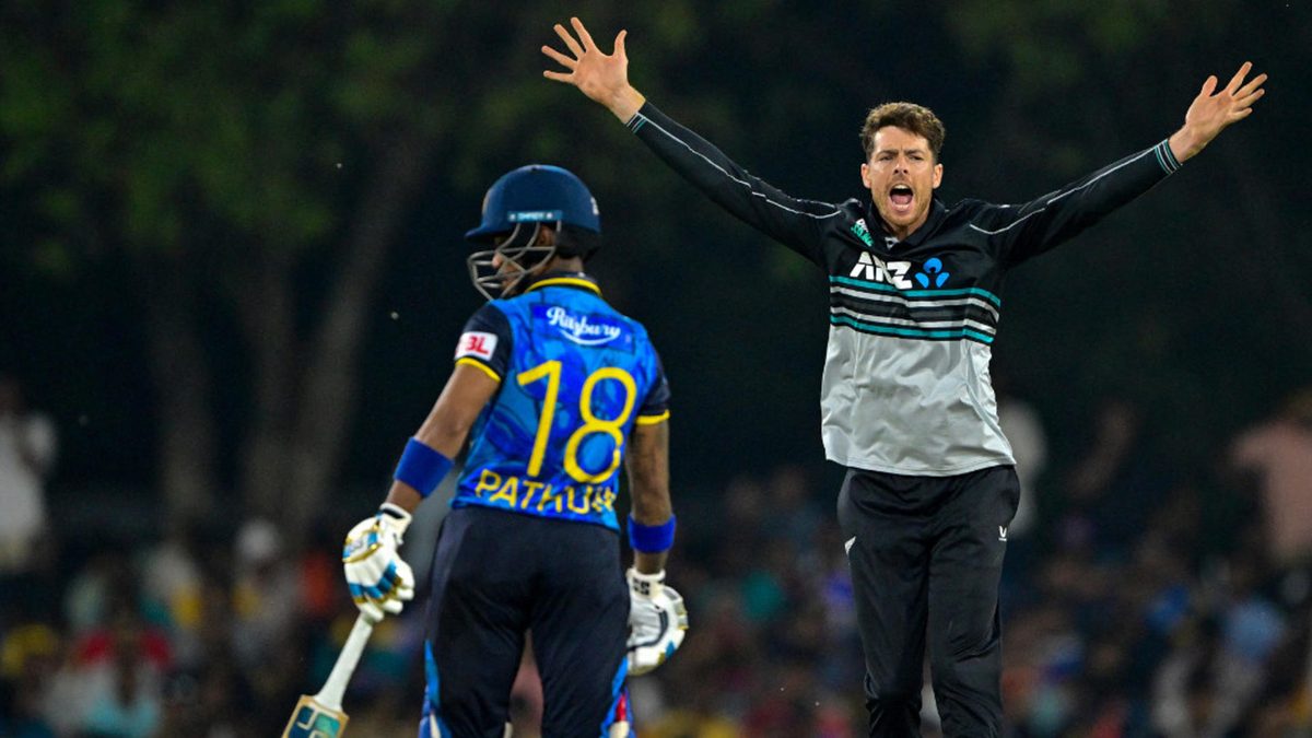 New Zealand's captain Mitchell Santner (R) celebrates after taking the wicket of Sri Lanka's Kusal Mendis during the first Twenty20 international cricket match between Sri Lanka and New Zealand at the Rangiri Dambulla International Stadium in Dambulla on November 9, 2024