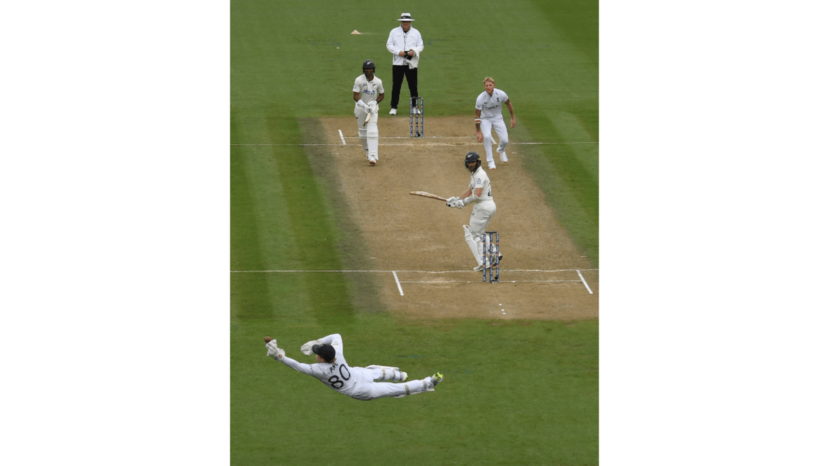 Ollie Pope of England dives but drops a catch from the bat of Kane Williamson as bowler Ben Stokes looks on during the Third Test Match in the series between New Zealand and England at Seddon Park on December 16, 2024 in Hamilton, New Zealand.