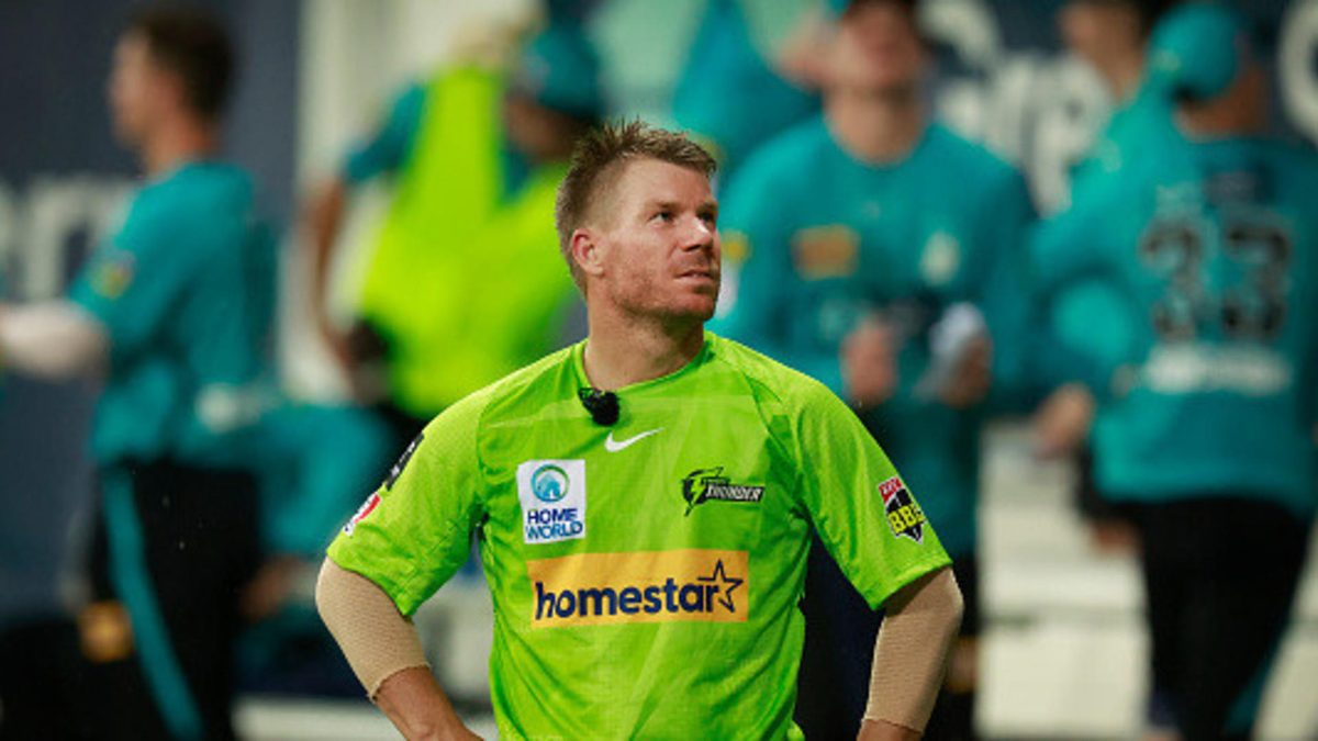 David Warner of the Thunder looks on during a rain delay in the Men's Big Bash League match between the Sydney Thunder and the Brisbane Heat at Sydney Showground Stadium, on January 27, 2023, in Sydney, Australia