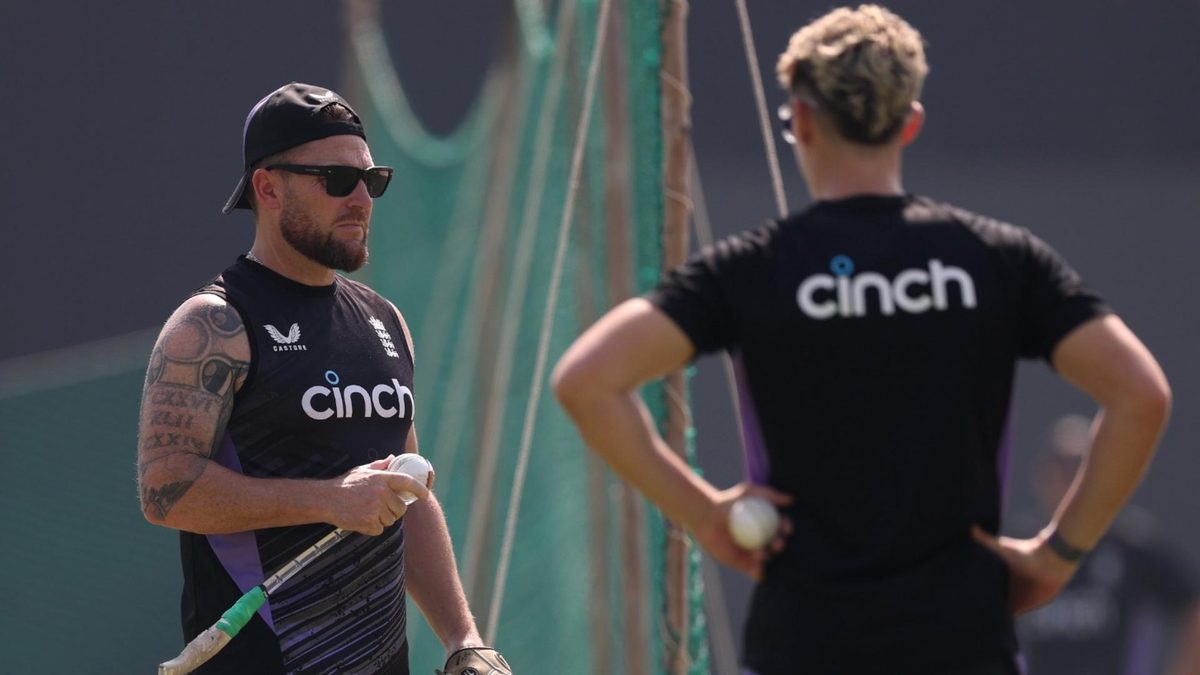 England head coach Brendon McCullum in conversation with Jacob Bethell during an England training session