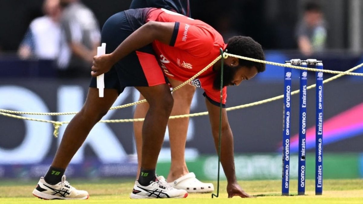 USA's Aaron Jones inspects the pitch ahead of the match against Ireland