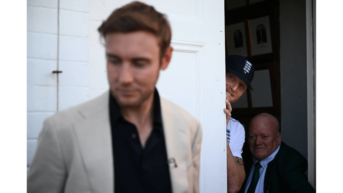 England captain Ben Stokes peers round a door at Stuart Broad.