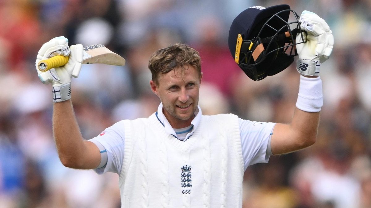 Joe Root celebrates scoring a Test hundred against India in Manchester