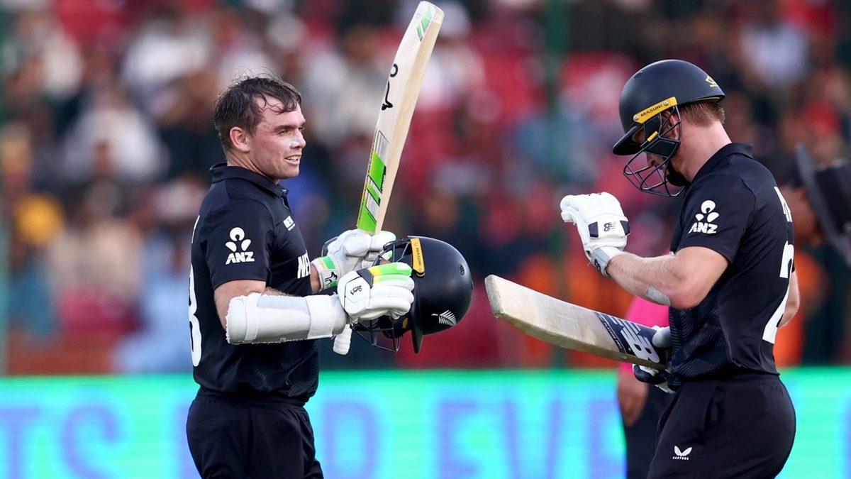 Tom Latham celebrates an eighth ODI century with Glenn Phillips