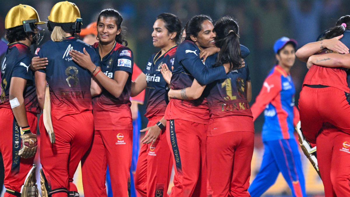 Royal Challengers Bangalore's players celebrate after winning the Women's Premier League (WPL) Twenty20 cricket final match against Delhi Capitals at the Arun Jaitley Stadium in New Delhi on March 17, 2024