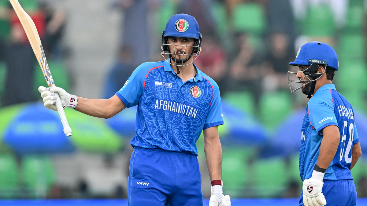 Afghanistan's Sediqullah Atal (L) celebrates after scoring a half-century 