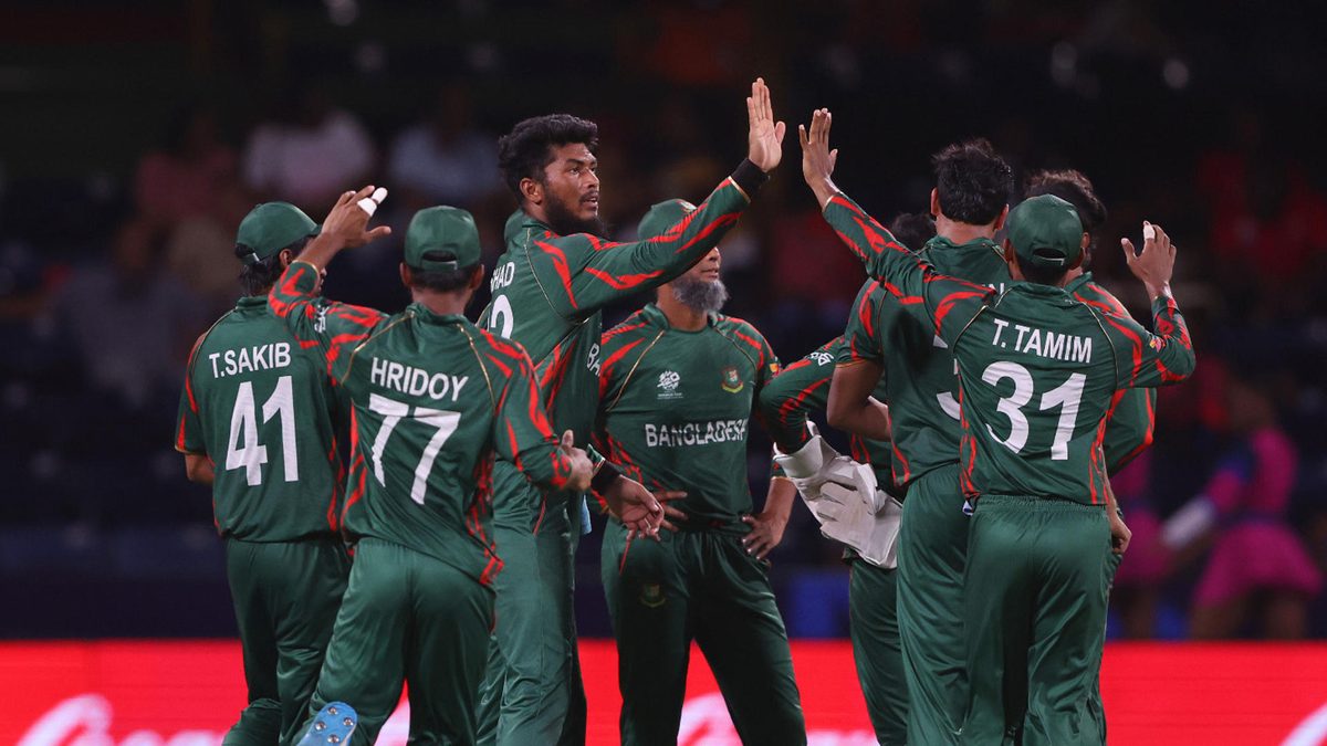 Rishad Hossain of Bangladesh celebrates with teammates after dismissing Gulbadin Naib of Afghanistan during the ICC Men's T20 Cricket World Cup West Indies & USA 2024 Super Eight match between Afghanistan and Bangladesh at Arnos Vale Ground on June 24, 2024 in St Vincent, Saint Vincent and The Grenadines