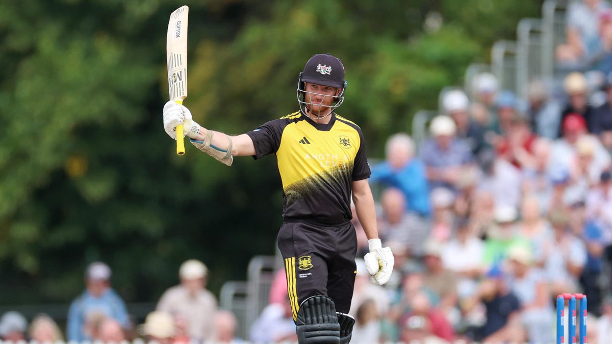 James Bracey of Gloucestershire acknowledges the crowd as he celebrates reaching his half-century during the Men's Metro Bank One Day Cup match between Gloucestershire and Derbyshire Falcons at College Ground on August 05, 2025 in Cheltenham, England