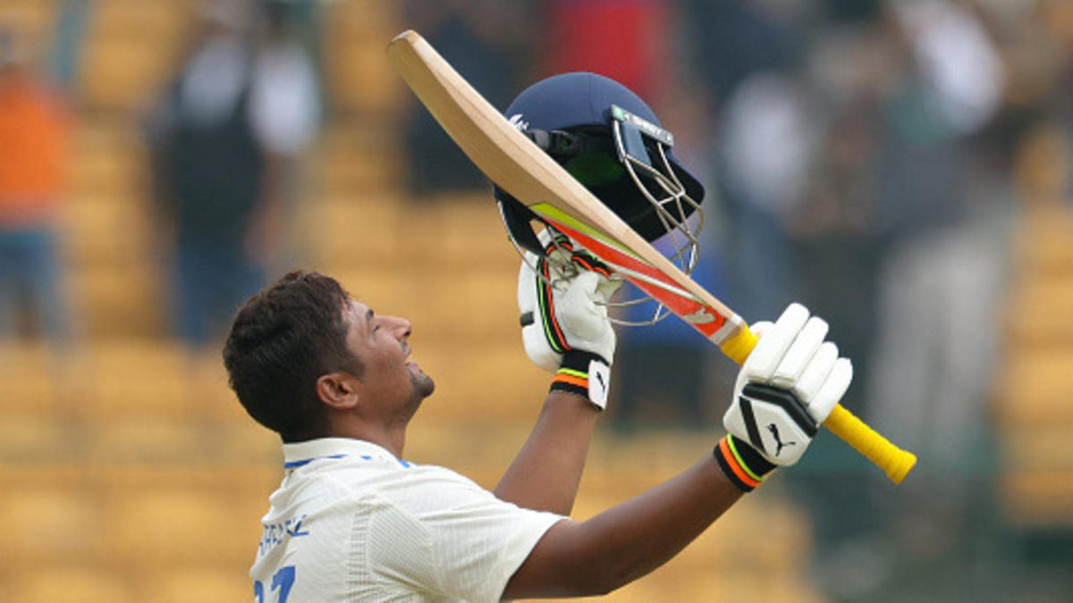 Sarfaraz Khan of India celebrates scoring a century during day four of the First Test match between India and New Zealand at M. Chinnaswamy Stadium on October 19, 2024 in Bengaluru, India