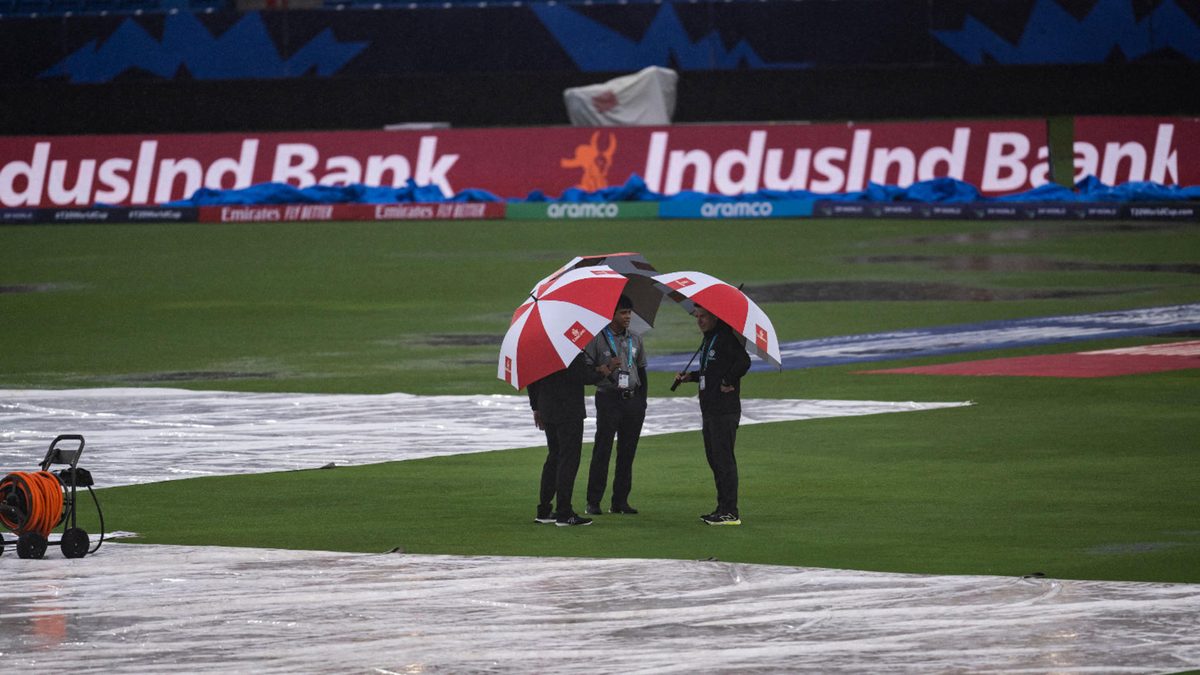 Match officials inspect the ground as it rains heavily before the ICC men's Twenty20 World Cup 2024 group D cricket match between Sri Lanka and Nepal at Central Broward Park & Broward County Stadium in Lauderhill, Florida, on June 11, 2024.