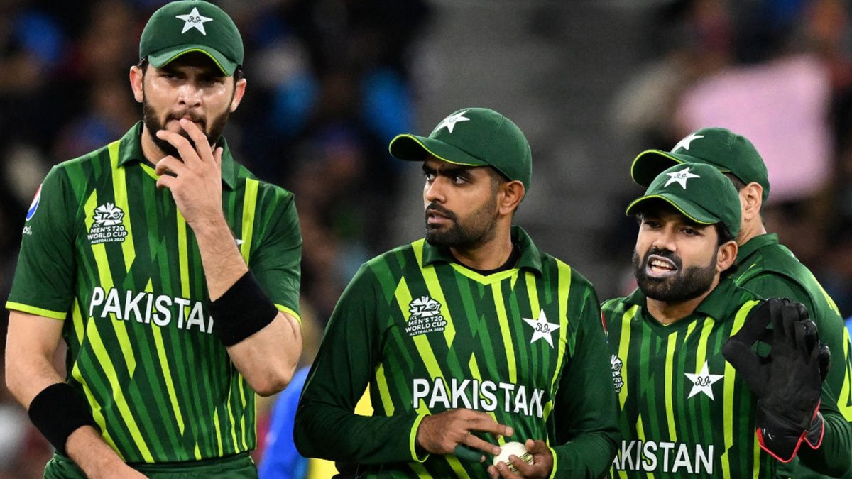 Pakistan's players, (L-R) Shaheen Shah Afridi, Babar Azam and Muhammad Rizwan, walk back to their fielding positions during the ICC men's Twenty20 World Cup 2022 cricket match between India and Pakistan at Melbourne Cricket Ground (MCG) in Melbourne on October 23, 2022.