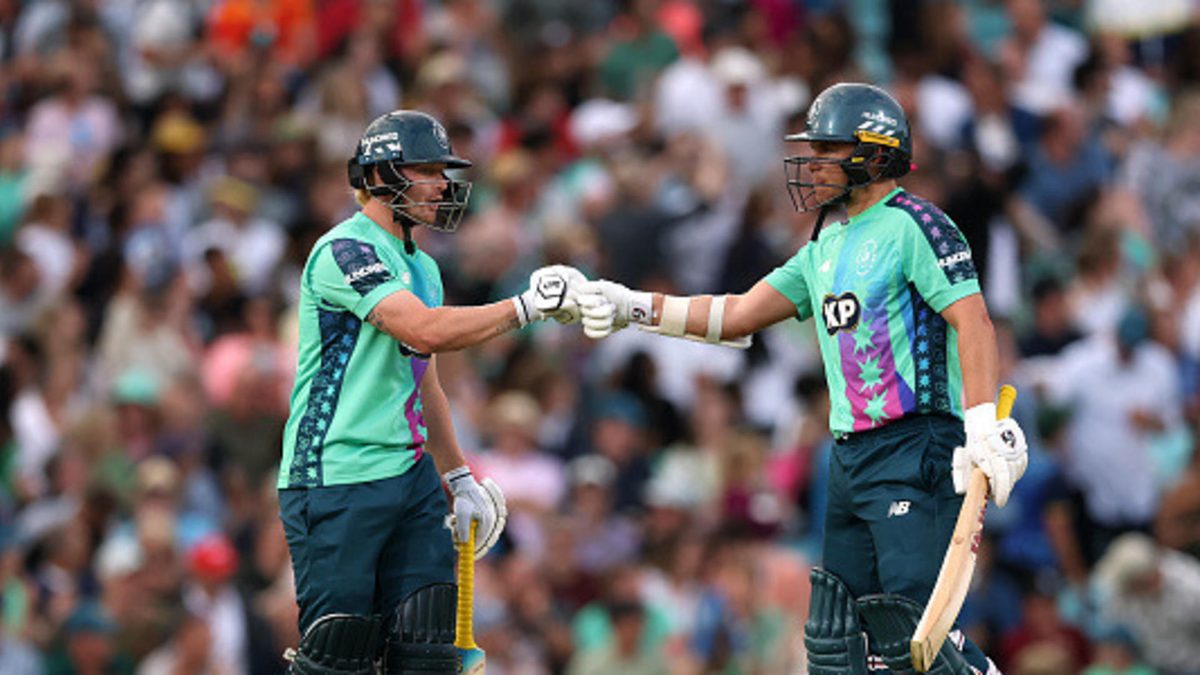 Jordan Cox of Oval Invincibles fist bumps team mate Sam Curran as they bat together during the The Hundred match between Oval Invincibles Men and Welsh Fire Men at The Kia Oval on August 16, 2025 in London, England