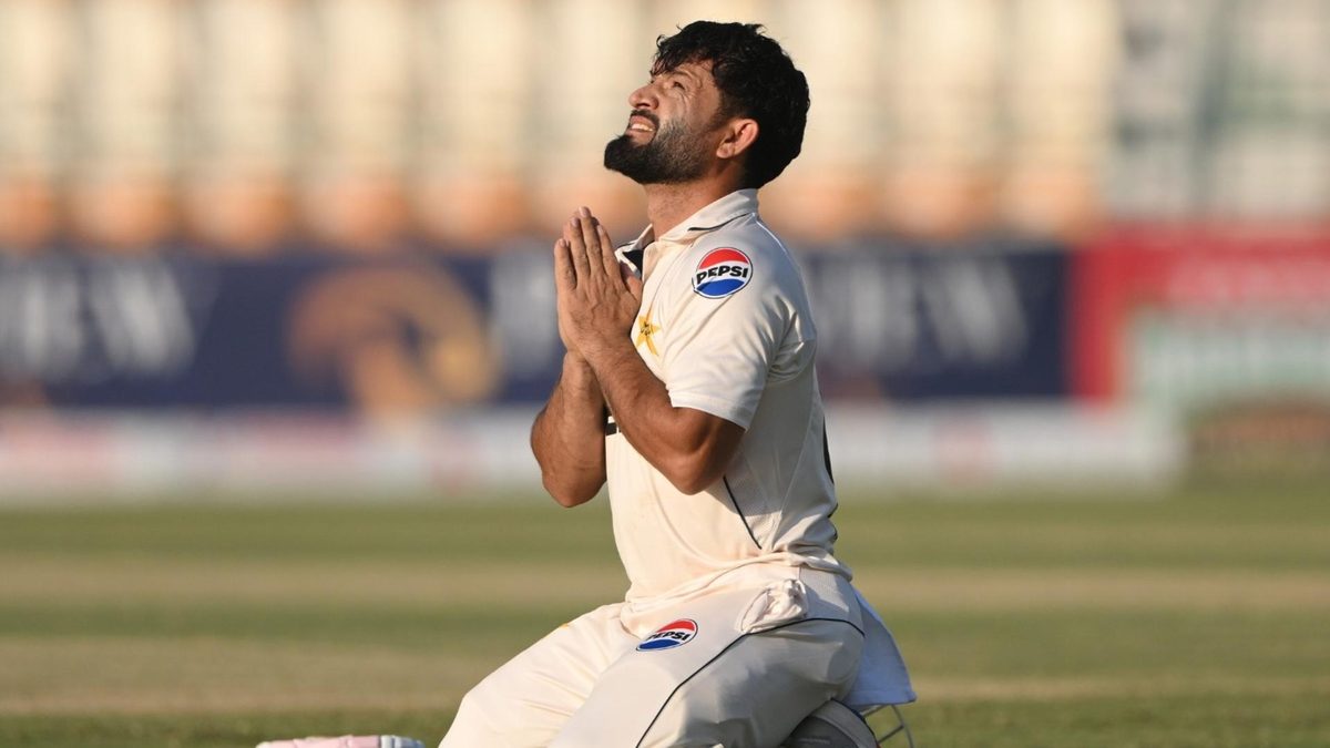 Kamran Ghulam celebrates scoring a century on Test debut