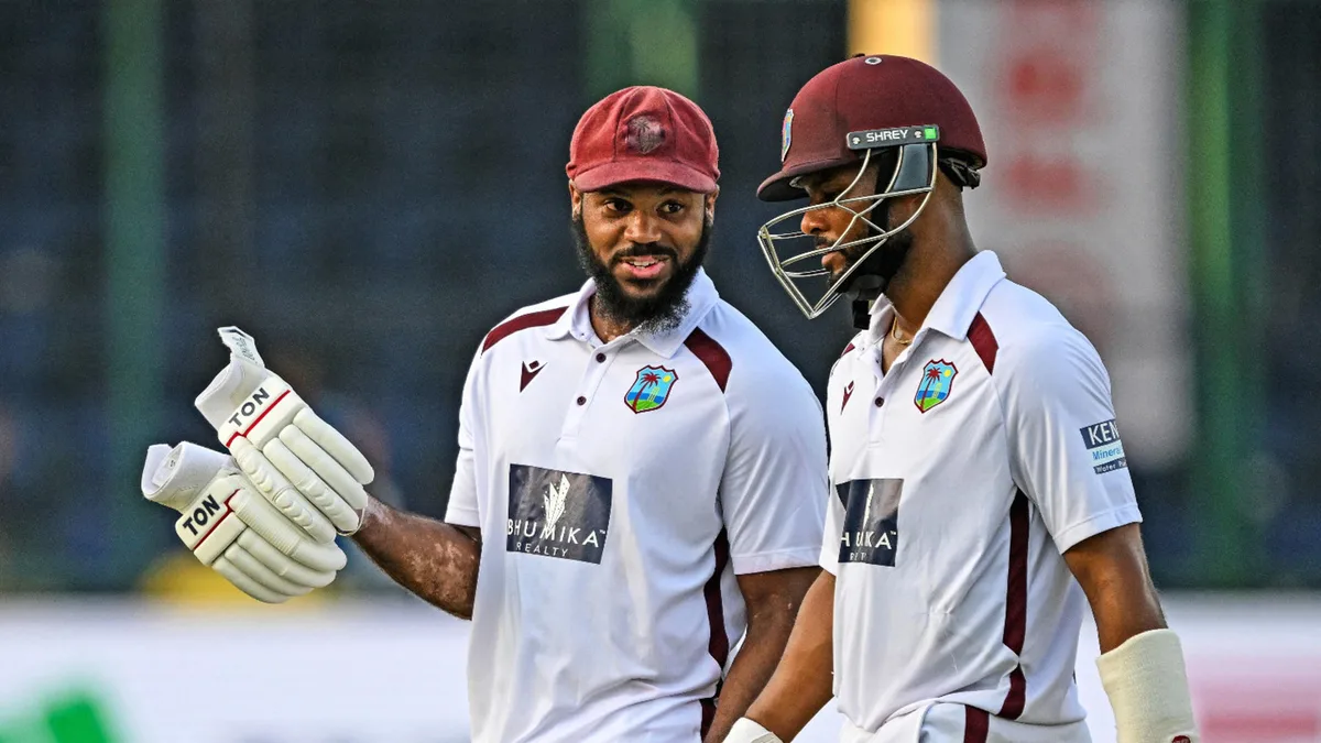 West Indies' John Campbell (L) and Shai Hope walk back to the pavilion at the end of play on the third day of the second and final Test cricket match between India and West Indies at the Arun Jaitley Stadium in New Delhi on October 12, 2025