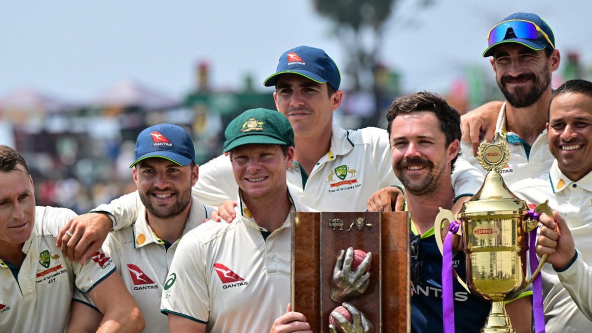Australia's players pose with the trophies after their win at the end of the second Test cricket match between Sri Lanka and Australia at the Galle International Cricket Stadium in Galle on February 9, 2025. Australia won the second Test against Sri Lanka by nine wickets in Galle on February 9, to sweep the series 2-0