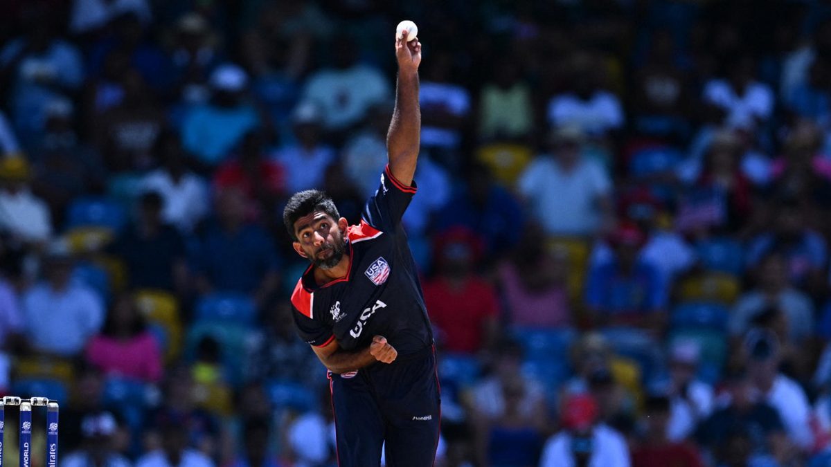 USA's Saurabh Netravalkar bowls during the ICC men's Twenty20 World Cup 2024 Super Eight cricket match between USA and England at Kensington Oval in Bridgetown, Barbados on June 23, 2024