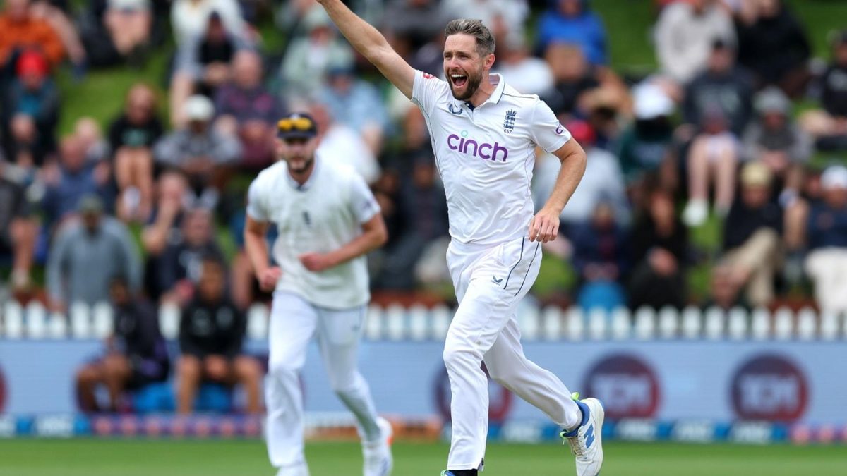 Chris Woakes celebrates taking a Test wicket for England