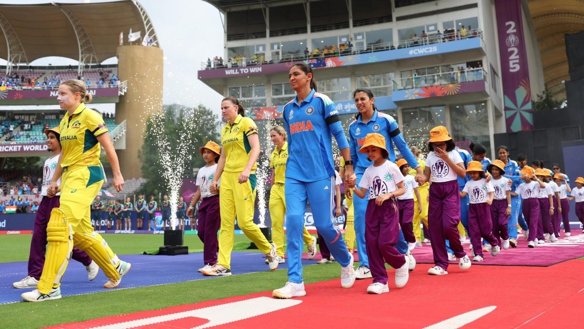 India and Australia walk out wearing black armbands in the Women's World Cup semi-final