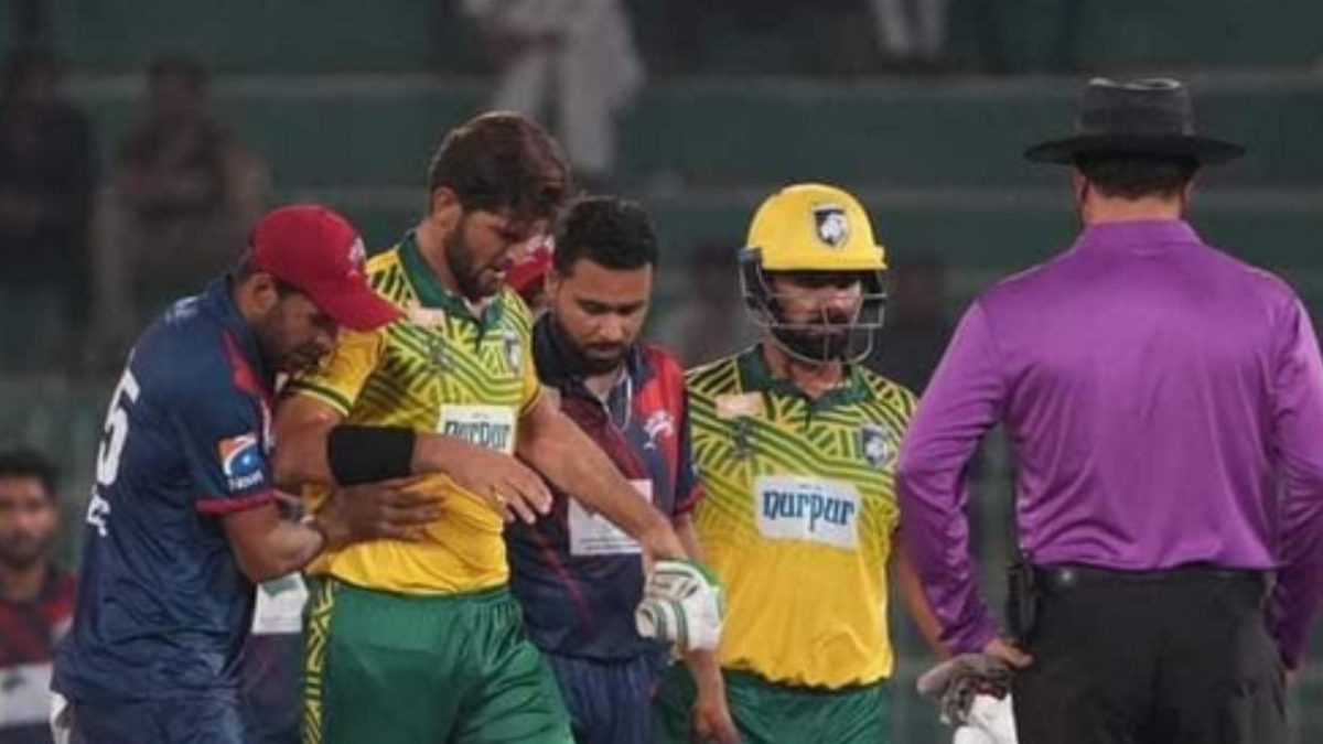 Shaheen Afridi being carried off the field after being hit on his knee in a Champions Cup match between Lions and the Dolphins