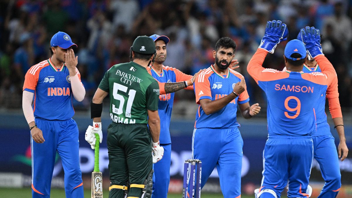 India's players celebrate after taking the wicket of Pakistan's Mohammad Haris during the Asia Cup 2025 Twenty20 international cricket match between India and Pakistan at the Dubai International Stadium in Dubai on September 14, 2025