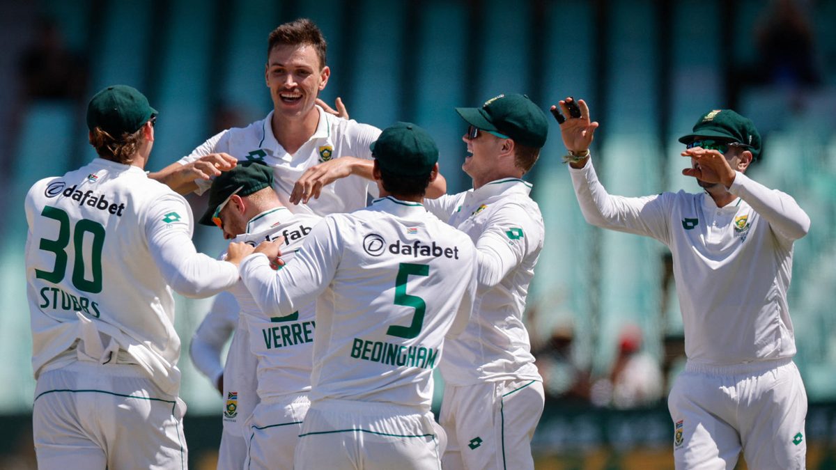 South Africa's Marco Jansen celebrates with teammates after the dismissal of Sri Lanka's Prabath Jayasuriya during the second day of the first Test cricket match between South Africa and Sri Lanka in Durban