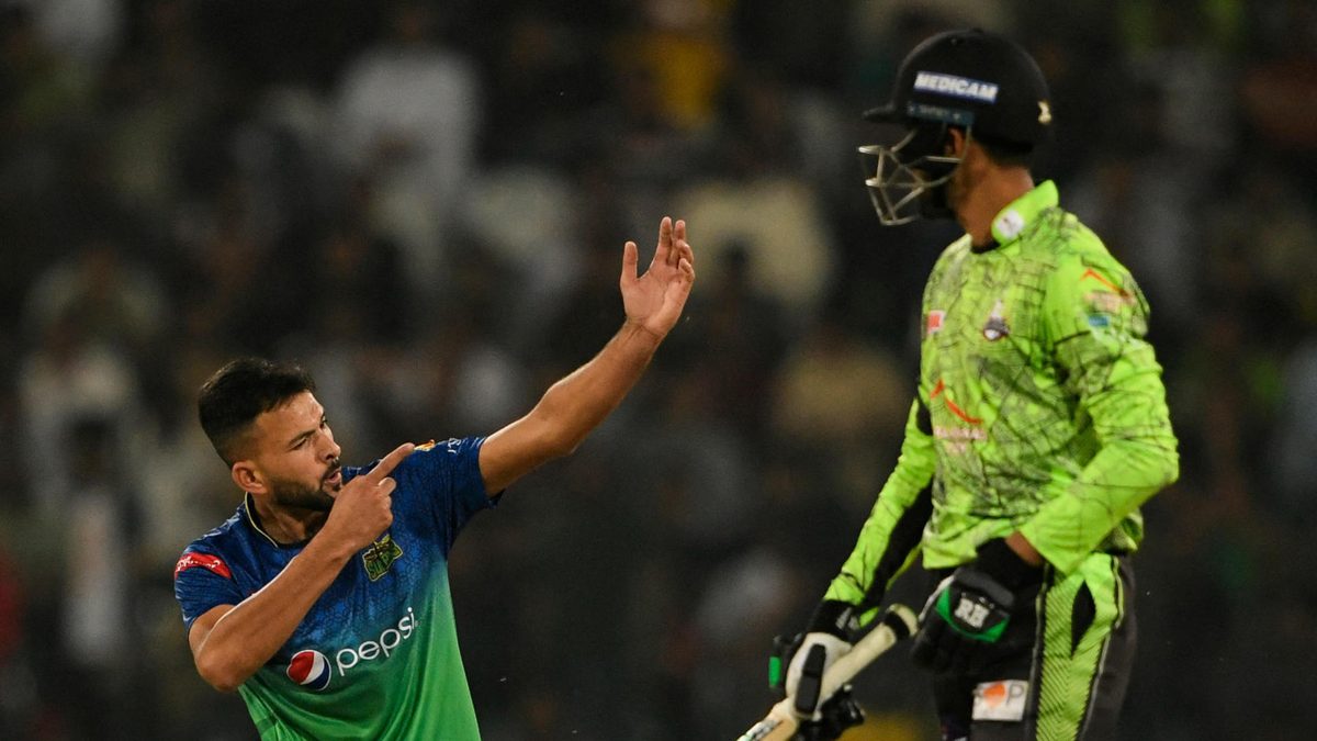 Multan Sultans' Ihsanullah (L) celebrates after the dismissal of Lahore Qalandars' Tahir Baig (R) during Pakistan Super League (PSL) Twenty20 cricket final match between Lahore Qalandars and Multan Sultans at the Gaddafi Cricket Stadium in Lahore on March 18, 2023.