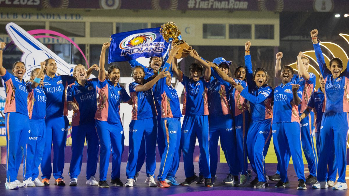 Mumbai Indians players celebrate with the winners trophy after the WPL Final match between Mumbai Indians and Delhi Capitals at Brabourne Stadium on March 15, 2025 in Mumbai, India