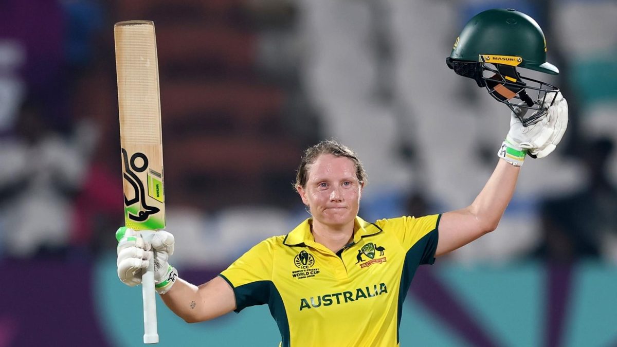 Alyssa Healy celebrates scoring a century against Bangladesh