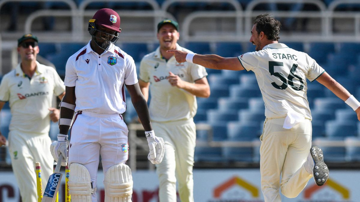 Jayden Seales (L) of West Indies reacts after being bowled by Mitchell Starc (R) of Australia during the third day of the third Test cricket match between West Indies and Australia at Sabina Park in Kingston, Jamaica, on July 14, 2025