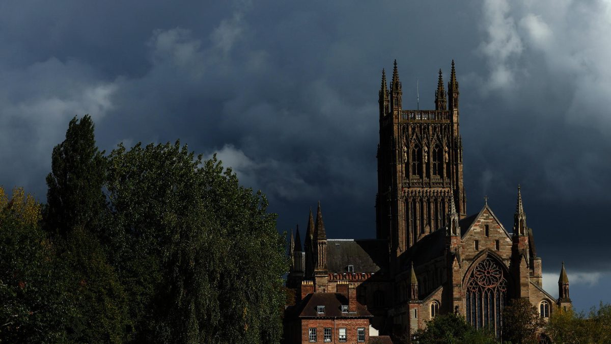 A general view of the action backdropped by Worcester Cathedral during Day One of the Vitality County Championship match between Worcestershire and Lancashire at Visit Worcestershire New Road on September 26, 2024 in Worcester, England