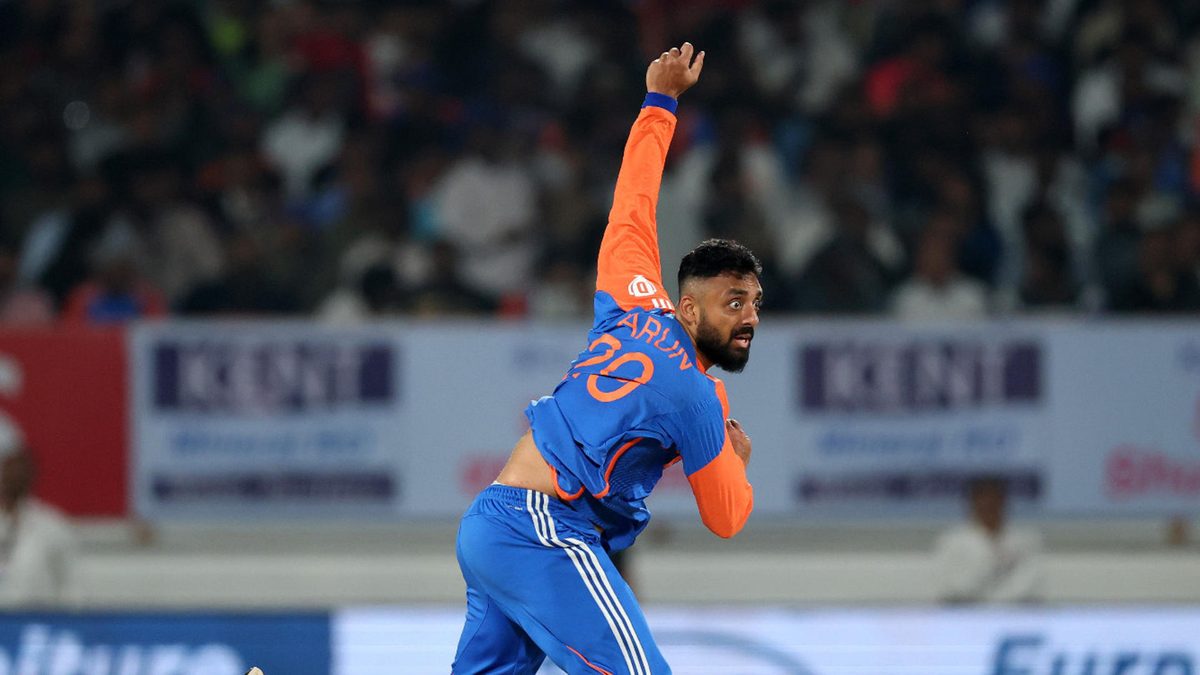 Varun Chakravarthy of India bowls during the International T20 match between India and England at Niranjan Shah Stadium on January 28, 2025 in Rajkot, India