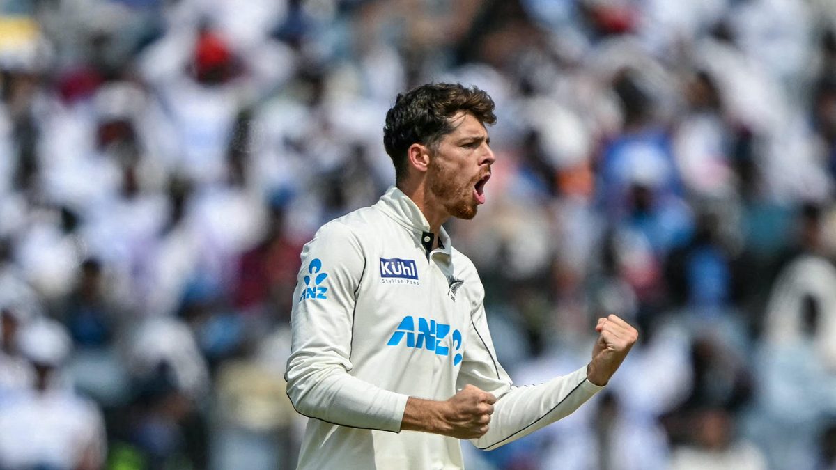 New Zealand's Mitchell Santner celebrates after taking the wicket of India's Yashasvi Jaiswal during the third day of the second Test cricket match between India and New Zealand at the Maharashtra Cricket Association Stadium in Pune on October 26, 2024