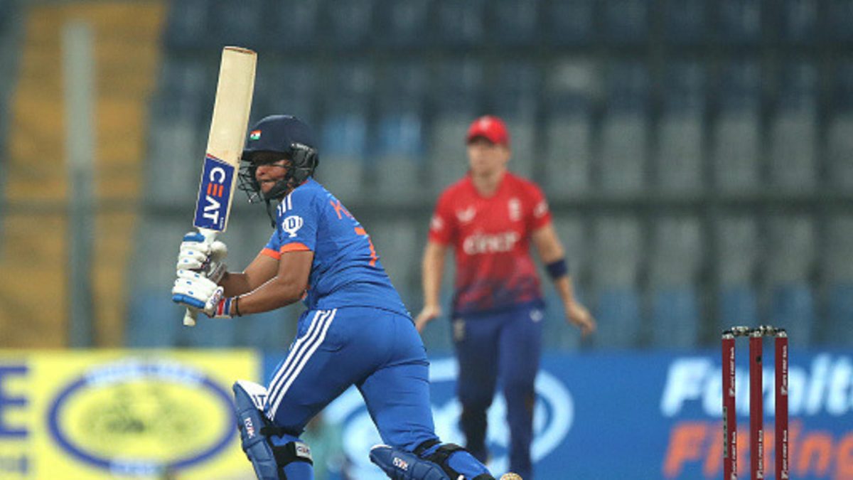Harmanpreet Kaur (C) of India plays a shot during the 1st T20 International match between India Women and England Women at Wankhede Stadium on December 6, 2023 in Mumbai, India
